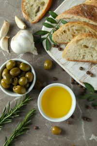concept-tasty-eating-with-olive-oil-gray-textured-table (1)